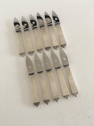 Georg Jensen Pyramide Sæt af 11 x Østersknive i Sterling Sølv og Rustfrit Stål. 
Med tidlige GJ Stempler