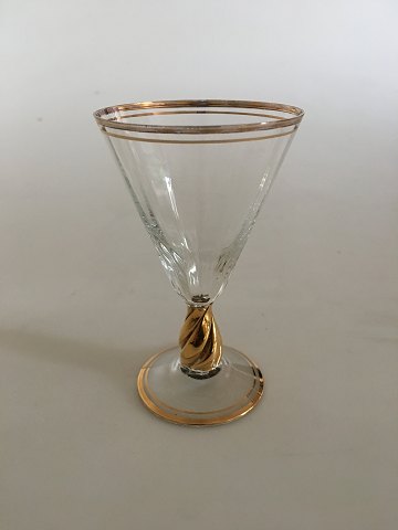 Holmegaard "Ida" hedvinsglas med guld på stilk, rand og fod.